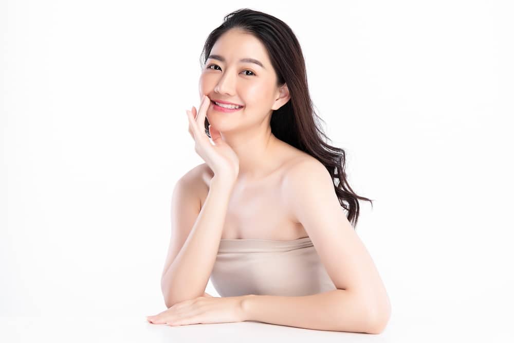 Woman touches her youthful skin after Deka CO2 deep skin ablation laser treatment in Lebanon